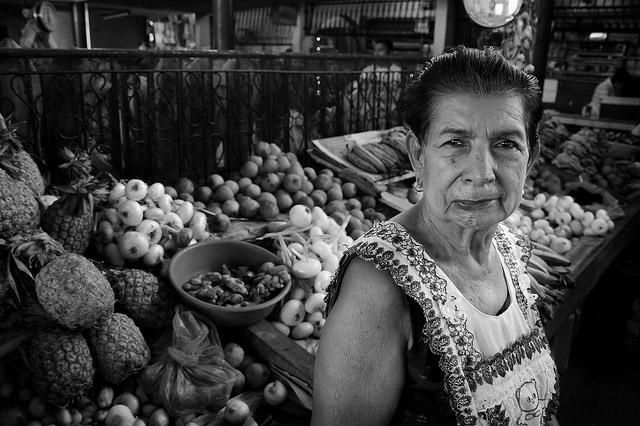A Nicaraguan market seller stands in front of her stall