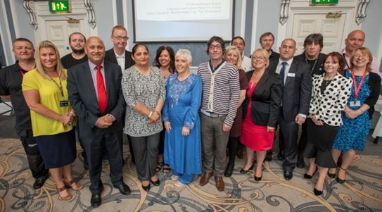 Mohammed Taj with Kirklees Council staff
