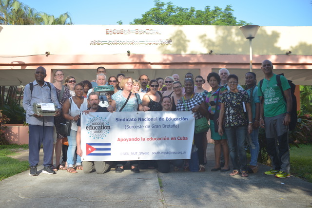 NEU members in Cuba holding a banner