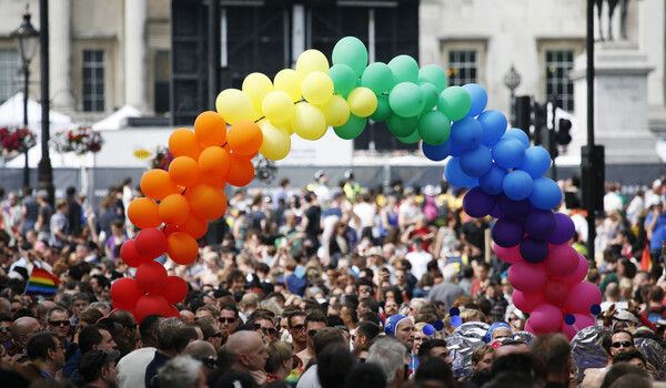 Balloon arch in crowd at Pride festival 