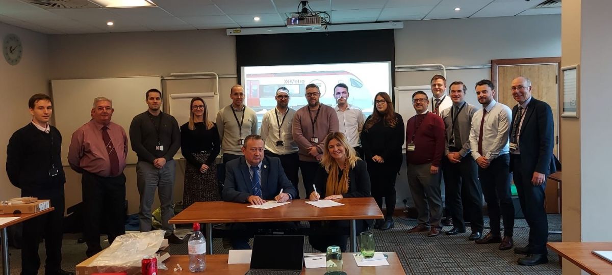 TfW Head of Human Resources & ALSEF District Organiser signing The Apprenticeship Charter