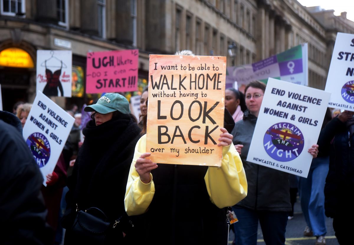 Person holding placard at Reclaim the Night march 