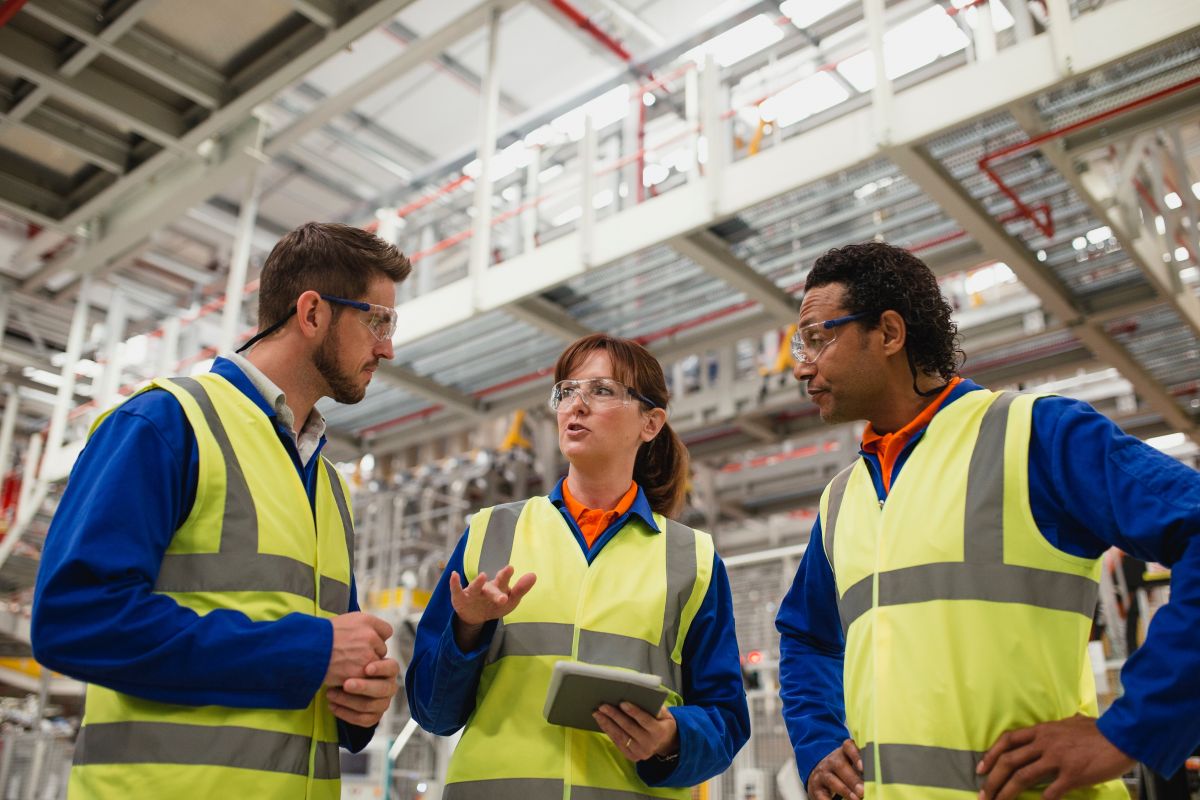 Three workers in hi vis