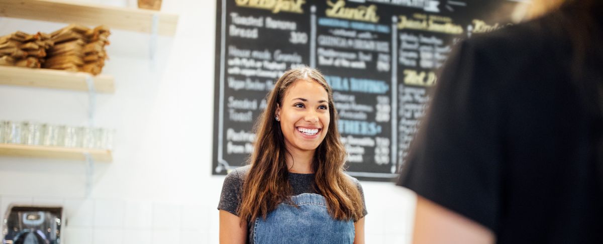 barista serving coffee