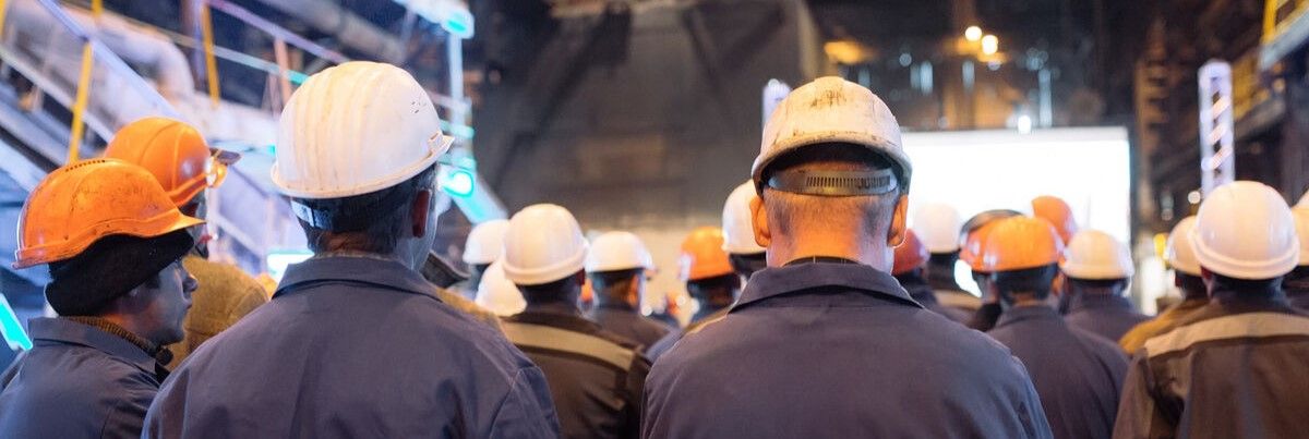 Industrial workers turn their backs