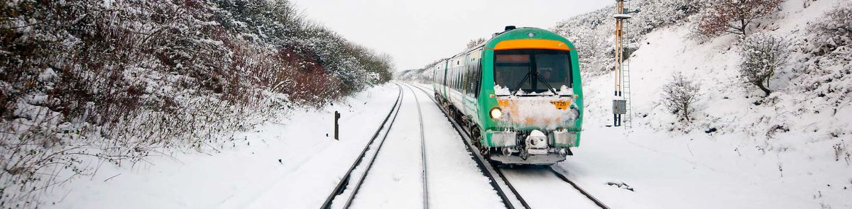 A train travelling through the snow on a winter's day