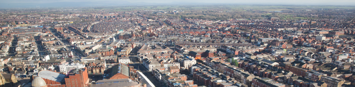 Aerial view of cityscape against sky
