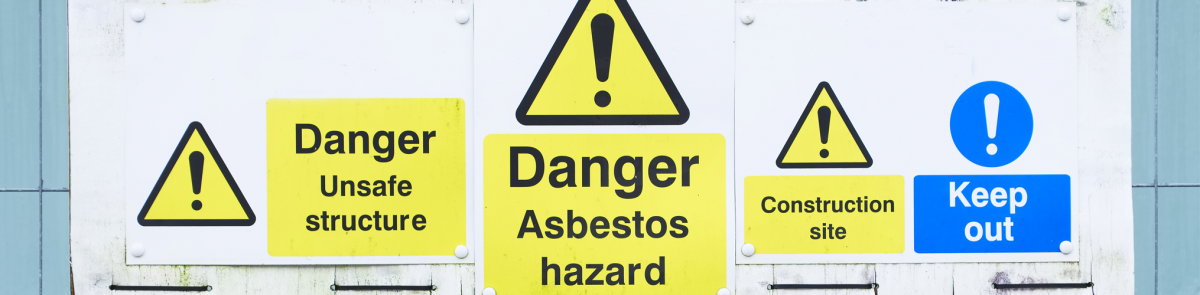 Asbestos hazard sign outside construction site