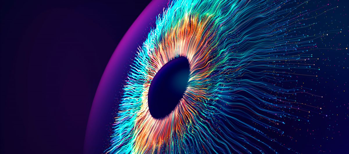 Digital generated image of multicolored particles forming eye shape against black background