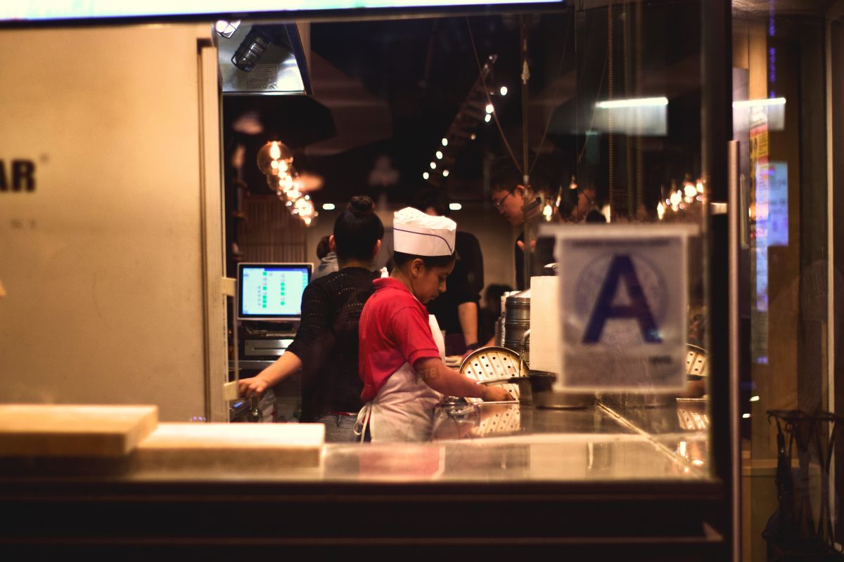 A kitchen worker prepares food