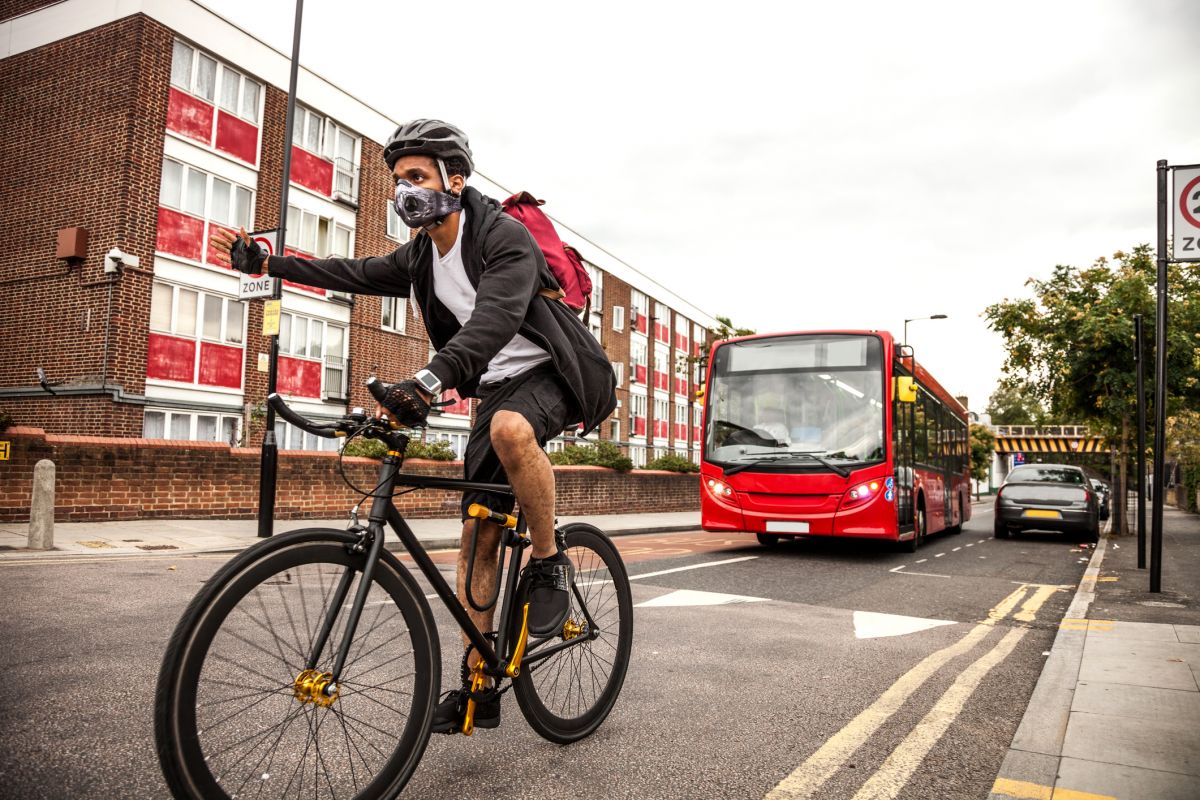 Cyclist wearing an air pollution mask