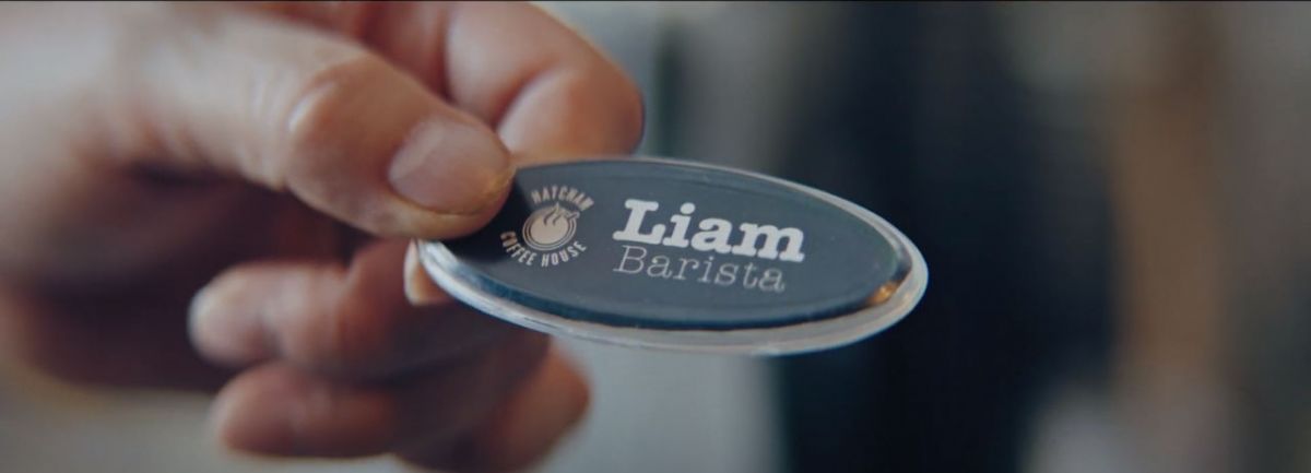 "Liam" name badge - a still from the film