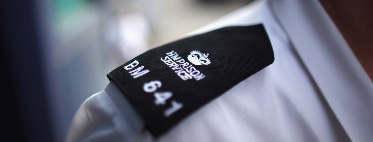 A close up of a prison officer's uniform
