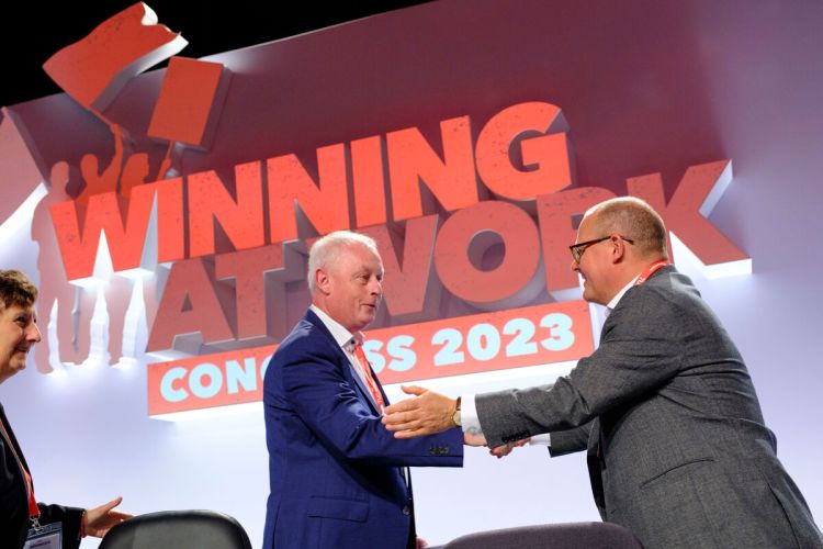 Paul Nowak shaking hands with Luc Triangle