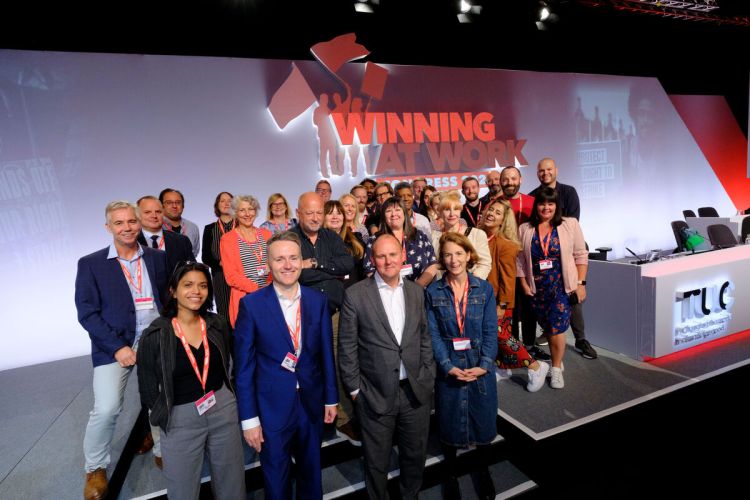 Crowd of TUC staff standing on stage at Congress