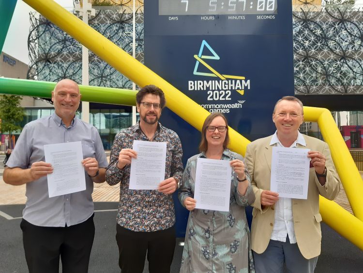 TUC CLIC members in front of Commonwealth Games clock, Birmingham