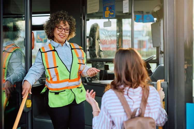 bus driver talking to a customer