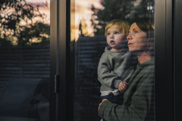 family looking out of a window