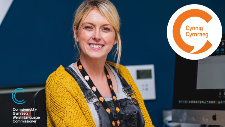 Women wearing Welsh language lanyard