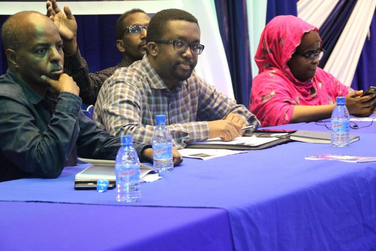 Photograph of Omar Faruk Osman with colleagues