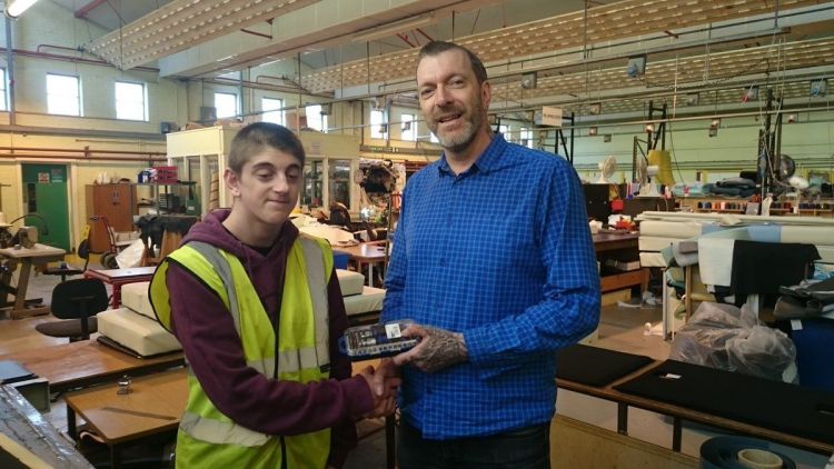Steve Gallin and a worker at their upholstery business in Exeter
