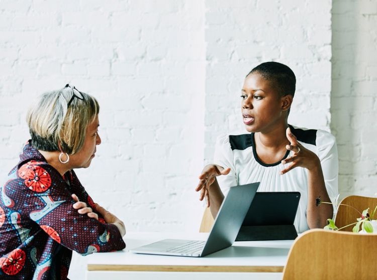 Two workers in discussion