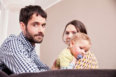 Family with small child looking at camera 