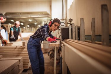 Female carpenter worker in carpentry factory