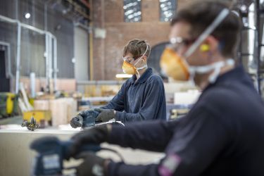 Workers wearing face masks at a factory.