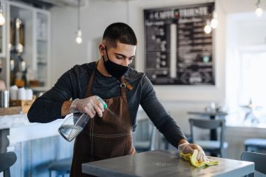 Young worker in bar