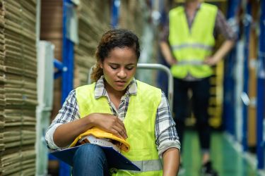 Young female warehouse worker.