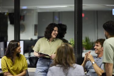 Happy entrepreneurs in business meeting at office