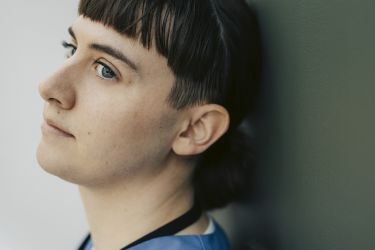 Close-up of thoughtful transgender nurse looking away