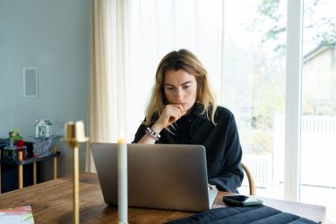 freelancer looking at laptop