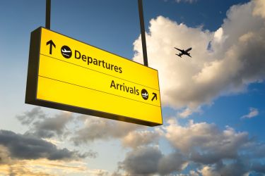 an airport sign showing arrivals and departures