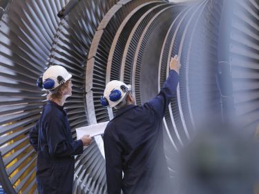 engineers looking at turbine