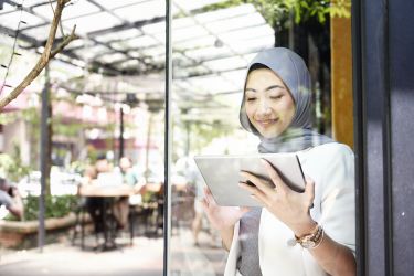 Woman at work using an iPad