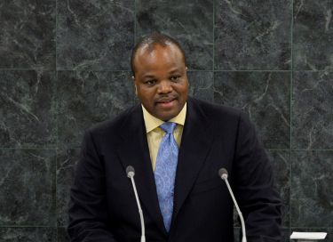 Photo of King Mswati III speaking at a lecturn