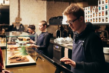 Young workers serving in a cafe