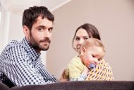 Family with small child looking at camera 