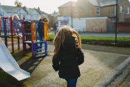 Child running into play park 