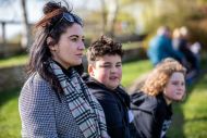 Mother and two children looking into distance 