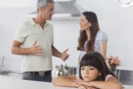 Stressed parents and sad child 