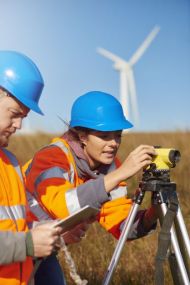 workers and wind turbine