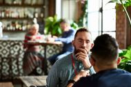 Man listening in a conversation with another man