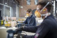 Workers wearing face masks at a factory.
