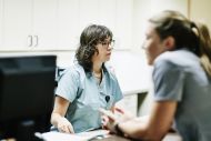 nurse at a desk