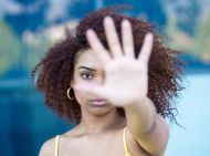 Women with hand in air indicating stop