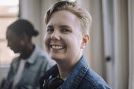 Portrait of smiling male computer programmer in office