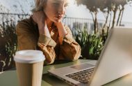 woman stressed sitting at a laptop